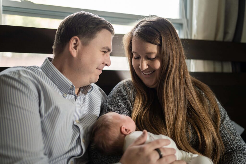 Loving glances are shared by new parents