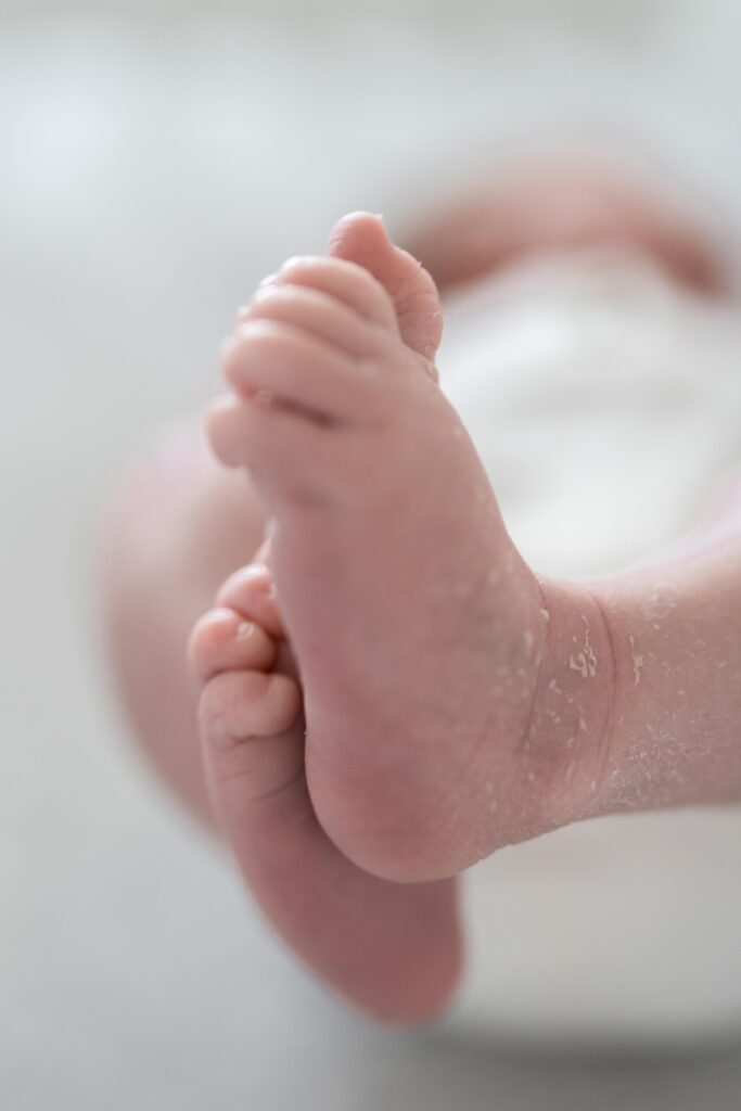 A closeup detail of baby's feet and toes