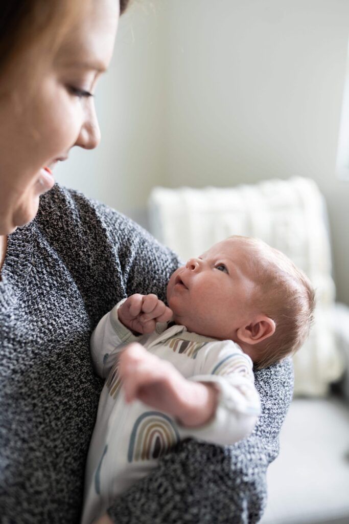 A mom holds her newborn baby