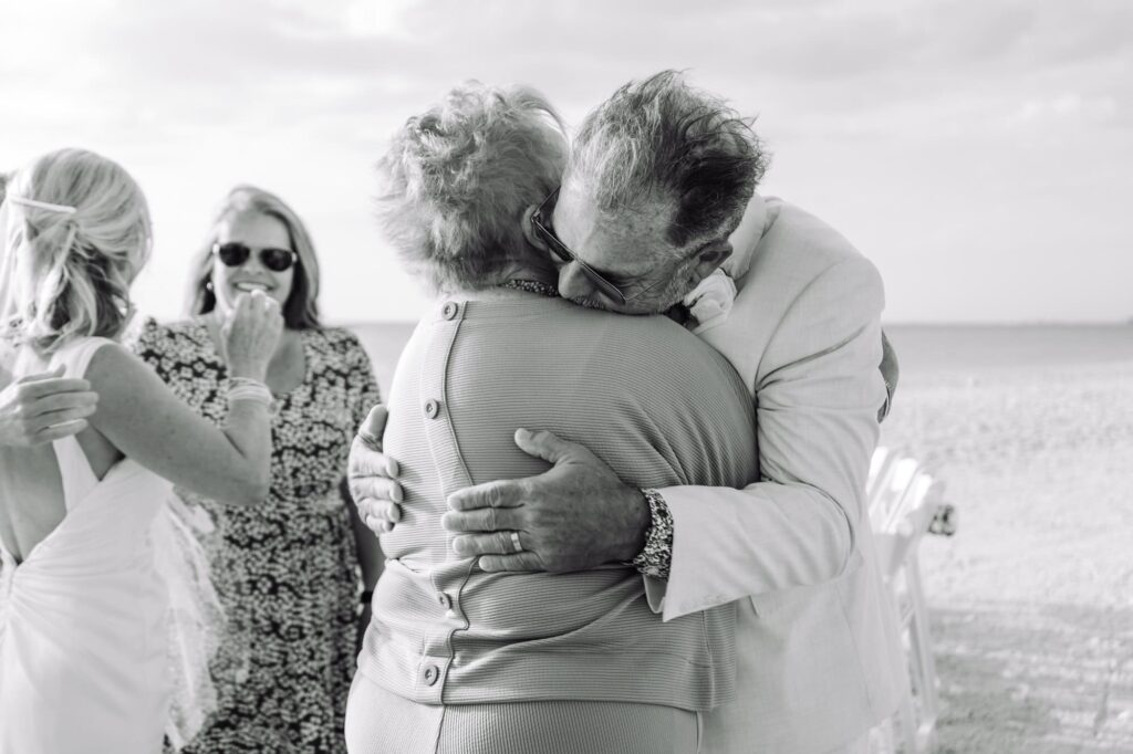 An emotional moment as the groom hugs his mother after his wedding ceremony
