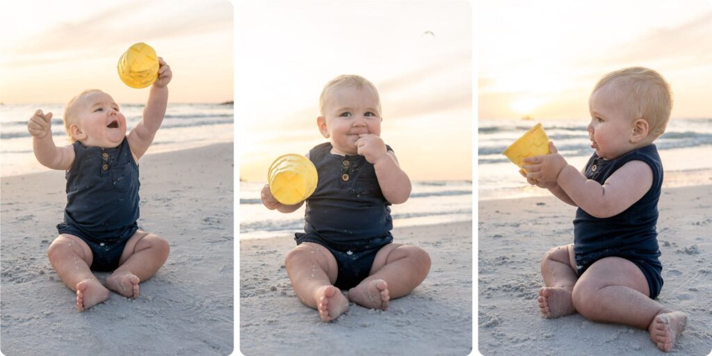 Baby sitting on the sand at Upham Beach, smiling and playing with a yellow bucket during candid family beach photos in St. Pete.