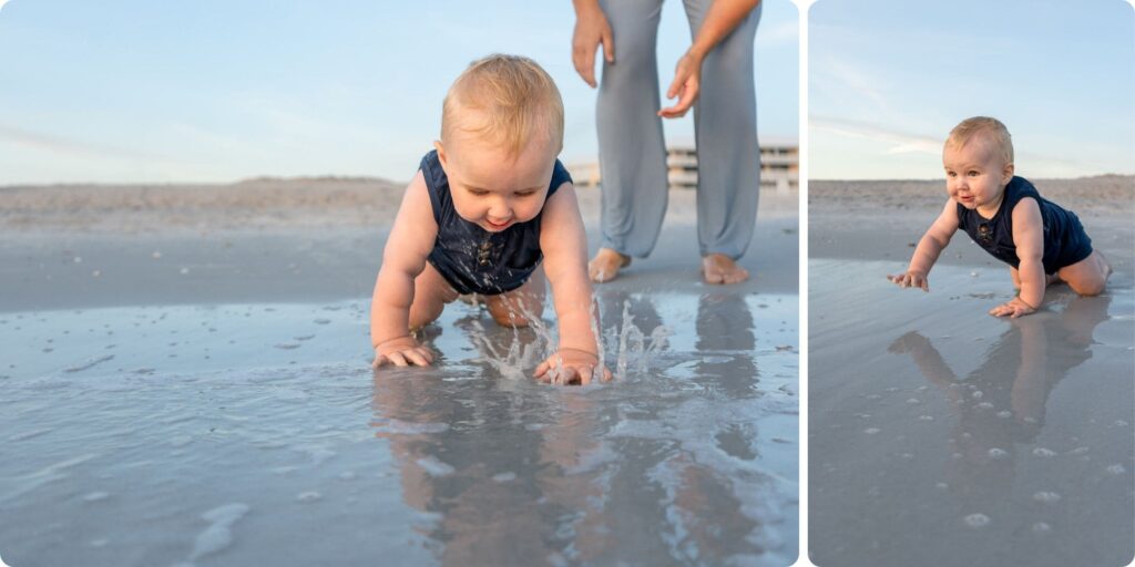 Baby crawling through shallow water at Upham Beach with parent close behind during candid family beach photos in St. Pete.