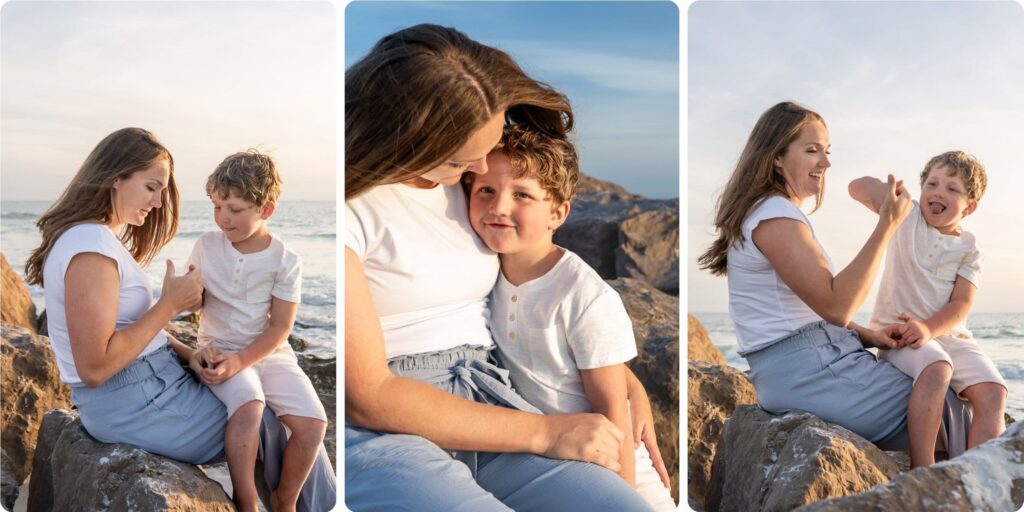 Mother and son sitting on the rocks at Upham Beach, laughing and sharing a quiet moment during sunset family photos in St. Pete.